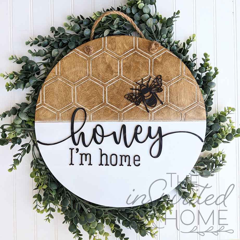 http://theinspiritedhome.com/cdn/shop/products/Honey-I_m-Home_Bee-Door-Hanger_The-Inspirited-Home_1200x1200.jpg?v=1623093665